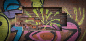 Graffiti på tegelvägg, detaljfoto